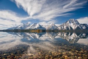 There is a thin line between the Tetons and their reflection that may someday change our lives.  Image captured by GJH vice-president John Hebberger, Jr.